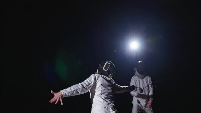 Skilled Fencer Attacking His Opponent On Fencing Track, Professional Swordsmen Fighting