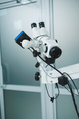 Modern medical equipment microscope in a bright office. Apparatus for diagnostics.
