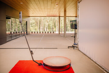 Valmiera, Latvia - July - 6, 2024 - 360-degree photobooth setup with circular platform and camera...
