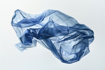 A blue plastic bag suspended in mid-air with a gentle breeze