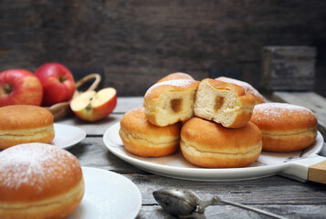 French cuisine. Apple jam filling sweet donuts (beignet), powdered sugar dressing