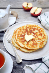 French cuisine. Matefaim. Sweet Apple Pancakes, butter and caramelized apples