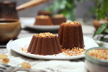 Chocolate panna cotta, or Chocolate and milk jelly dessert, cocoa powder and nut praline dressing