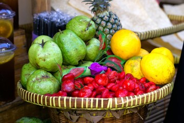 An assorted mix of tropical fruits on market display, street market vendor 