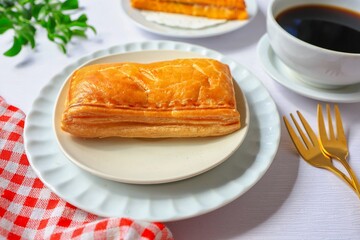 Tuna puff, crispy puff with hot  black  coffee for breakfast with white background