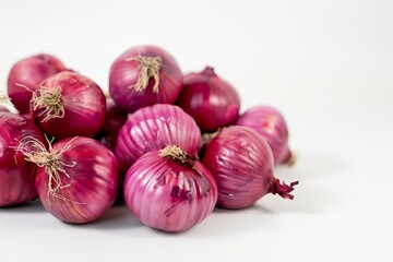 Freshly harvested red onions on white background