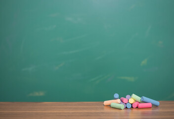 Multicolor chalk on wooden with chalkboard for education background