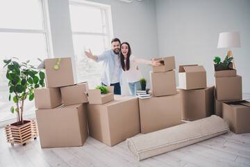 Fototapeta premium Full size photo of two young partners arms welcome you relocating moving box package new modern flat indoors