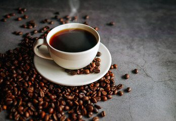 Coffee cup and coffee beans on  gray background, Black coffee cup aromatic