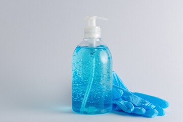 Hand sanitizer in a bottle on a bright background. Coronavirus prevention concept.