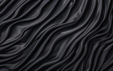 Obraz premium Close-up of black silk fabric with elegant, flowing textures and waves. Perfect for backgrounds, fashion design, or textile industry visuals.