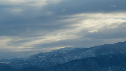 Mountains During Winter Time. Evergreen Tree-Covered Mountain Landscape After A Snow Storm. Timelapse.