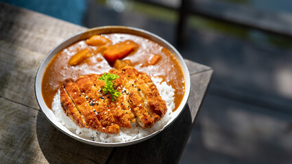 A bowl of food with rice and meat