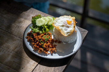 A plate of food with rice, meat, and vegetables