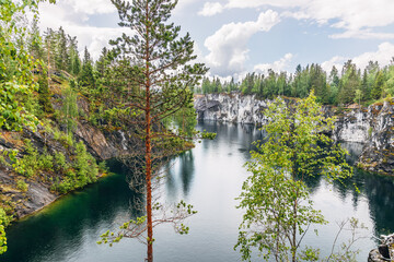 Fototapeta premium Ruskeala, Karelia, Russia - 8 July, 2023: Landscape of the mountain park Ruskeala in the Republic of Karelia