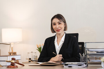Confident Female Lawyer Reviewing Legal Contract Documents in Modern Office Setting