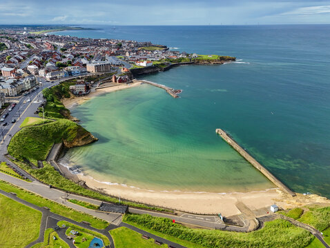 Aerial image of Cullercoats Bay along the North East Coast near Tynemouth, Northumberland. United Kingdom. 7th  July 2024.