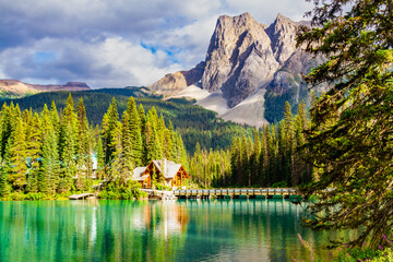 Landscape of the rocky mountains .  Wooden bridge and building on Emerald Lake. Yoho National Park, British Columbia, Canada