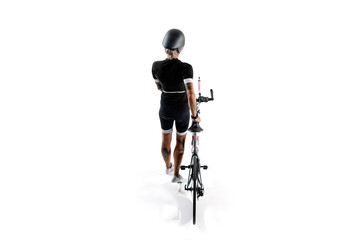 Woman in black sportswear and helmet standing with modern bike isolated on white background. Competitive athlete. Concept of sport, competition, tournament, speed, endurance, energy. Isometric view
