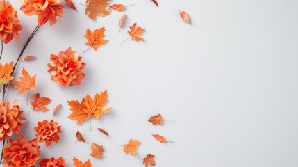 Thanksgiving wreath featuring orange flowers and maple leaves on white backdrop Seen from above with space for text