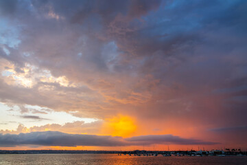 Naklejka premium Dramatic sky at sunset in San Diego Bay, California