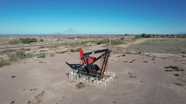  Aerial view of oil pump, AIB, near Route 40. Nevada Andes mountain range in the background.
