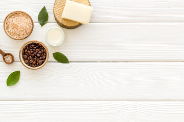 Organic care cosmetics set with coffee scrub and sea salt, top view