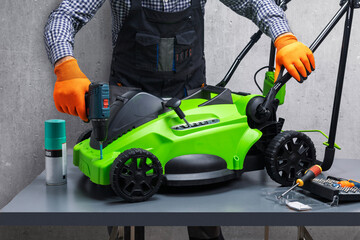 Mechanic working on lawn mower.