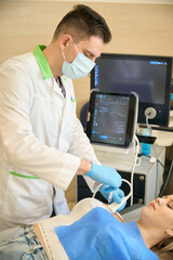 Female doing ultrasound-guided fine-needle aspiration cytology of breast lesion