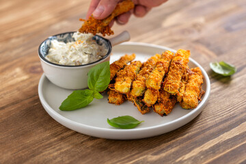 Crispy baked zucchini fries with dipping sauce Healthy food