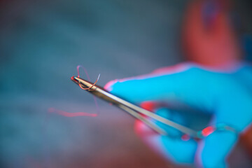 Doctor using sharp-blade cutting instrument during surgery