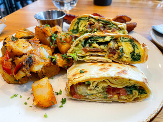 spinach egg wrap with potatoes at cafe 