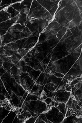 A close-up shot of a polished marble surface in black and white