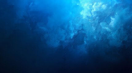 Abstract ocean depths with deep blue hues and a tranquil underwater ambiance.