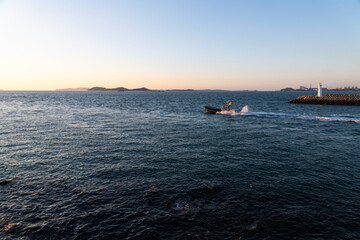 fishing boat on the sea in late afternoon