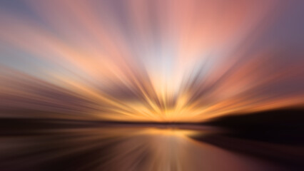 Colorful sunset over the sea. Blurry background of the sunset sunrise sky with rushing clouds and...