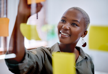Black woman, glass wall and sticky note for business strategy, project and meeting reminder in office. African lady, moodboard and notes for startup planning, brainstorming and franchise development