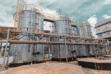 Stainless vertical steel tanks and pipes with pressure meter in equipment tank chemical cellar at the with stainless steel