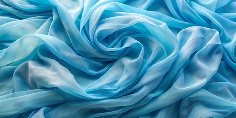 Obraz premium Softly rumpled blue chiffon fabric with gentle waves and luxurious texture, creating a serene and sophisticated background ideal for fashion, beauty, or luxury brand promotions.