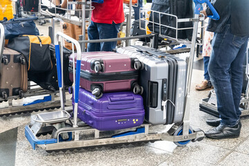 Luggages bags on trolley cart in airport departure terminal waiting for check-in before flight