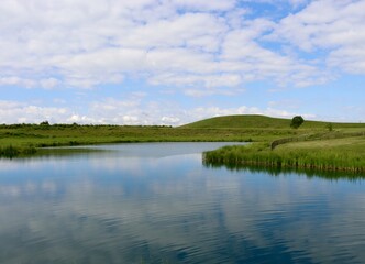 Fototapeta premium The quiet lake in the countryside on a sunny spring day.