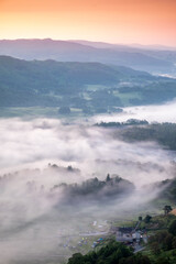 A small cloud inversion in the valley during sunrise