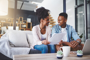 Budget, laptop and couple with documents on sofa for bills, life insurance or mortgage. Lens flare,...