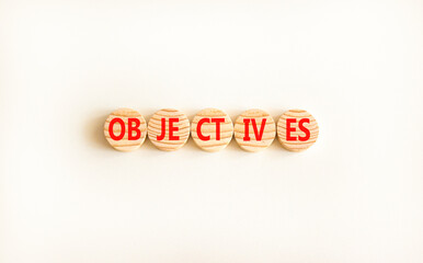 Objectives symbol. Concept word Objectives on beautiful wooden circles. Beautiful white background. Business objectives concept. Copy space.