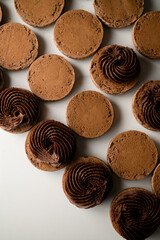 Light brown preparations for macaron of almond flour on a marble table