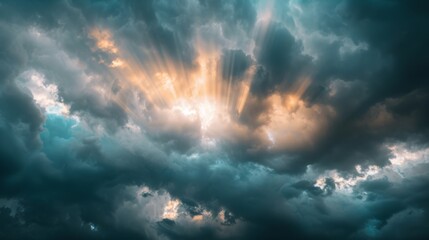 Sun rays breaking through dark storm clouds in a dramatic sky.