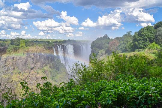 Victoria Falls,  Mosi-Oa-Tunya waterfall, view from the Zimbabwe side with a rainbow.