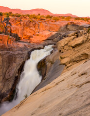 The impressive main fall of the Augrabies waterfall in the golden light of the late afternoon.