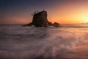 Camel beach, Santander, at dawn, with sunlight reflecting in the sea water