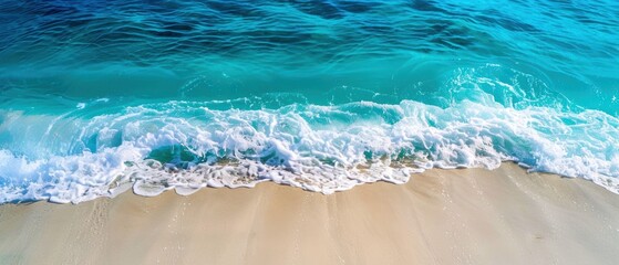 Obraz premium Vibrant Ocean Waves Washing Over Sandy Shore. A picturesque scene of vibrant blue ocean waves gently washing over a sandy beach, capturing the serene beauty of nature.